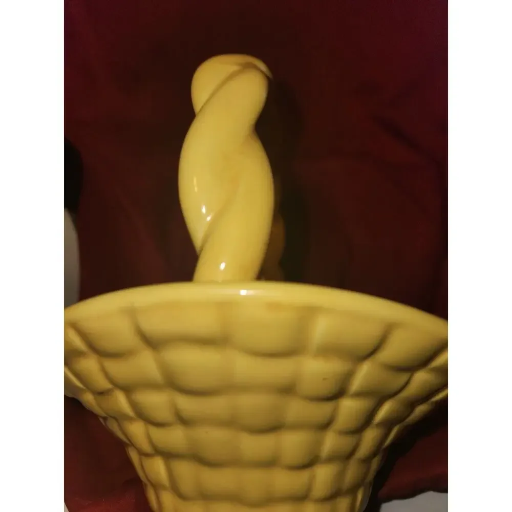 yellow ceramic basket has Leitsch on bottom